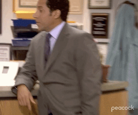 Gif of Oscar from the show The Office smiling and saying "yes".
